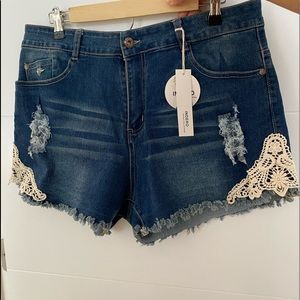 Jean Denim shorts with white crochet detail.